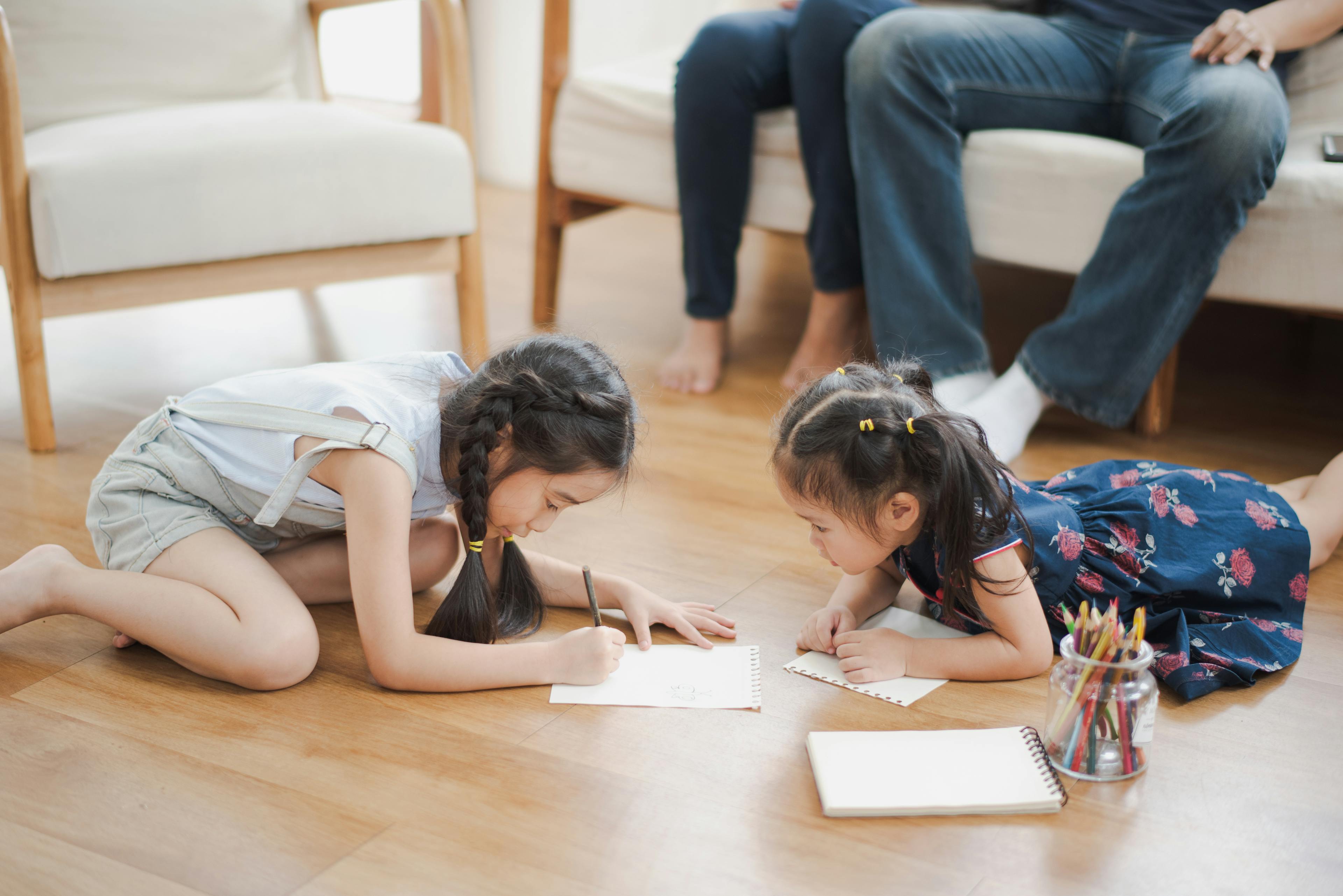 Children drawing whilst sitting on Laminate Flooring