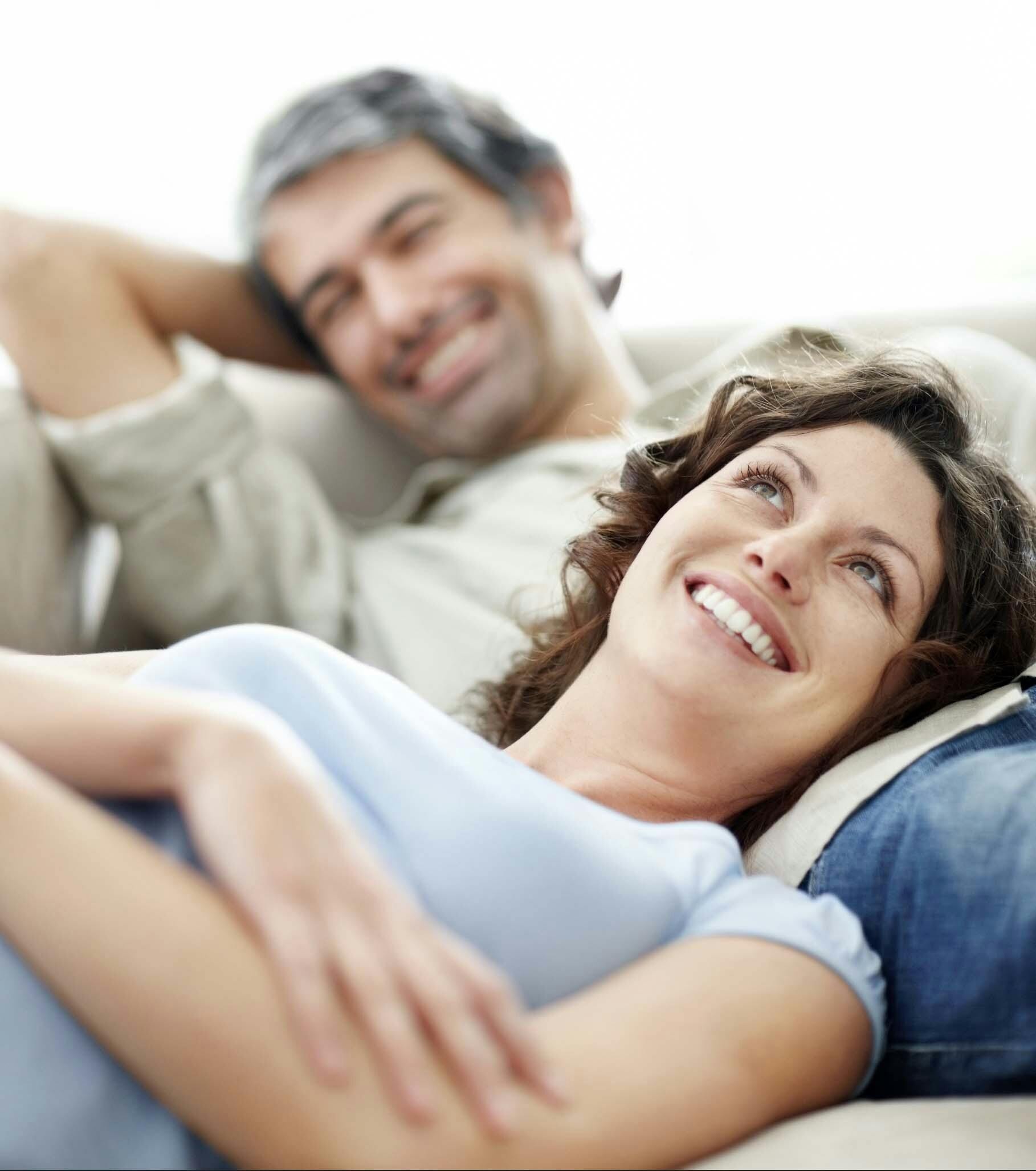Couple relaxing in the comfort of their home